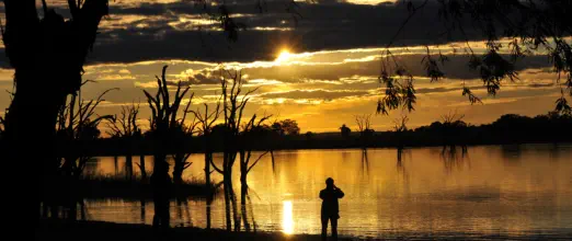 Lake Bonney SA sunset with a bodyguard in the shadows ...